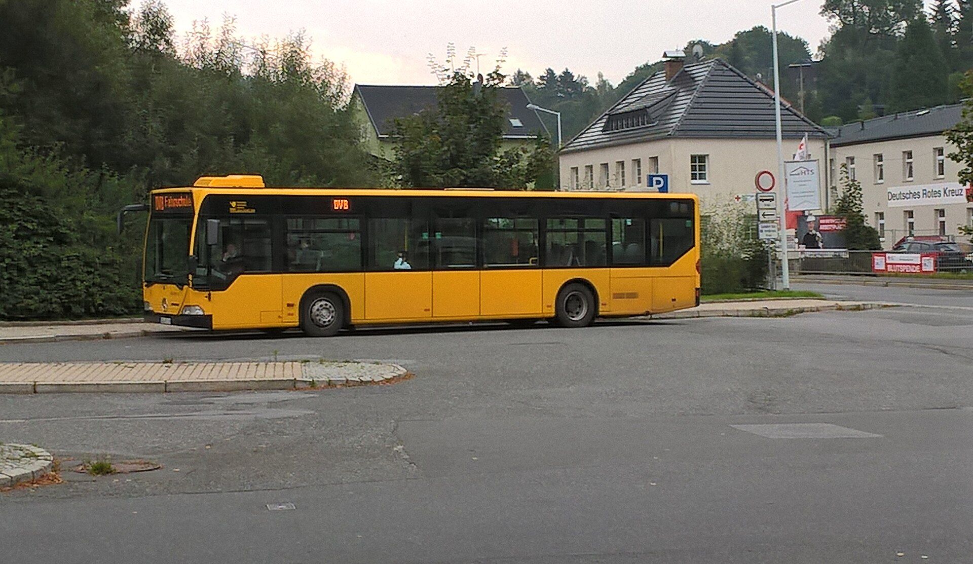 Yellow Dresdner Verkehrsbetriebe city bus showing Fahrschule on its destination display at the bus station in Sebnitz