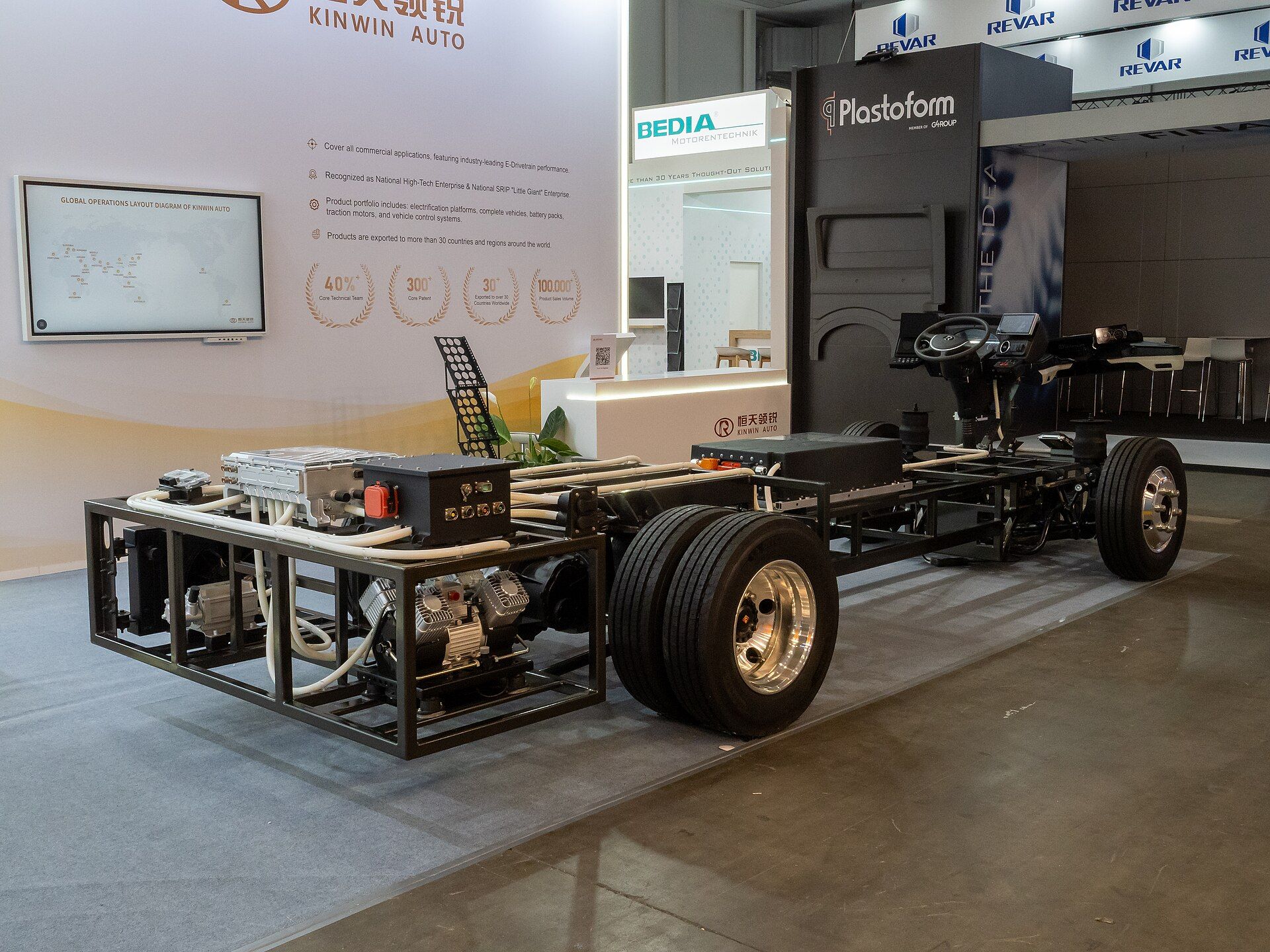 Bare bus chassis without bodywork on a manufacturer's stand at Busworld Europe 2025 in Brussels