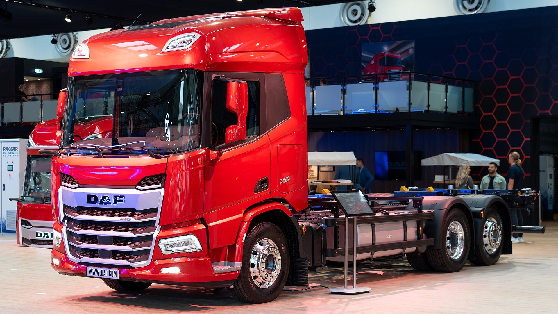 Red DAF XD 450 FAN rigid chassis without a body, on the DAF stand at IAA Transportation 2024