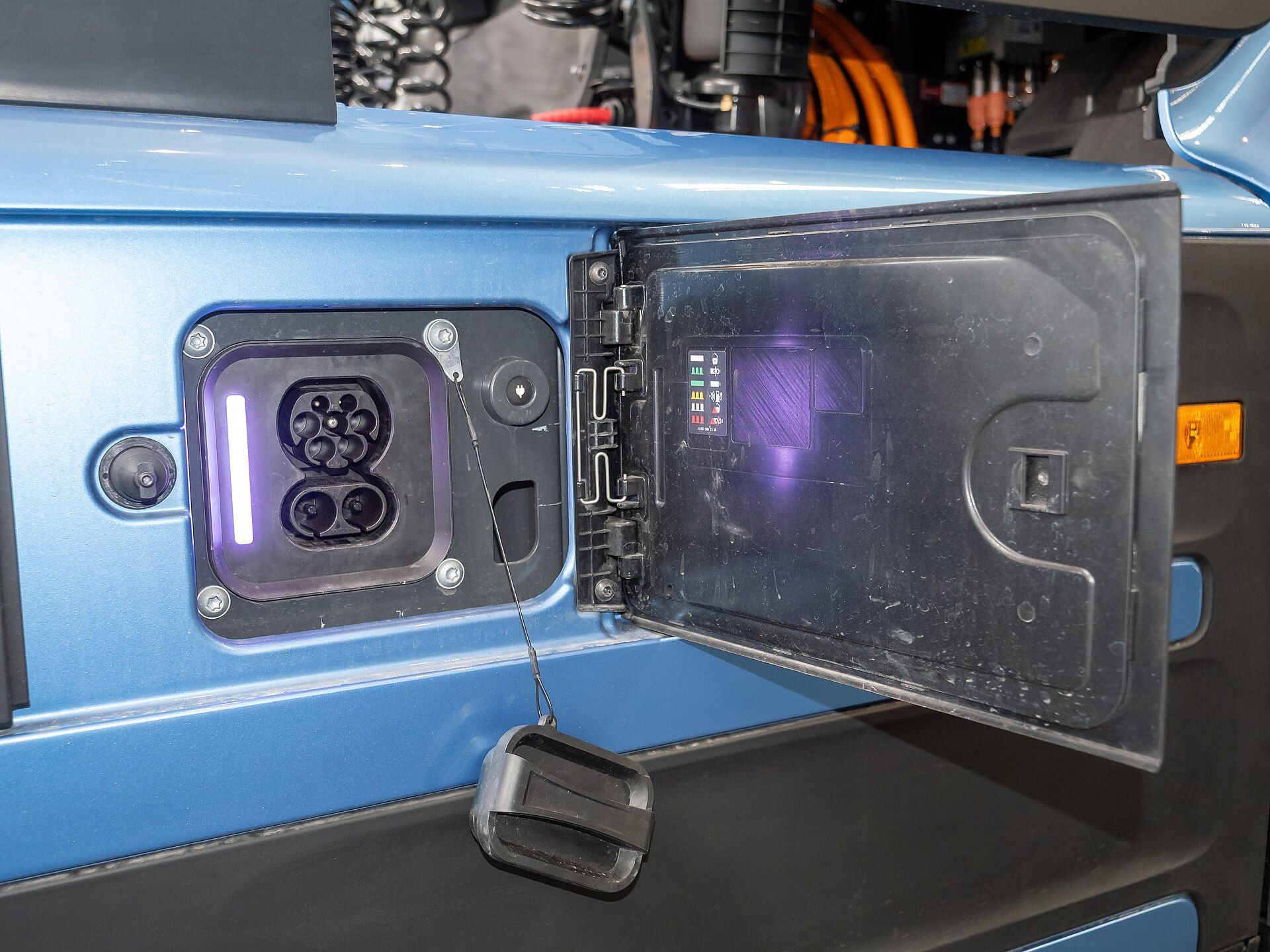 Open charging flap on a Mercedes-Benz eActros 600 showing the CCS2 socket