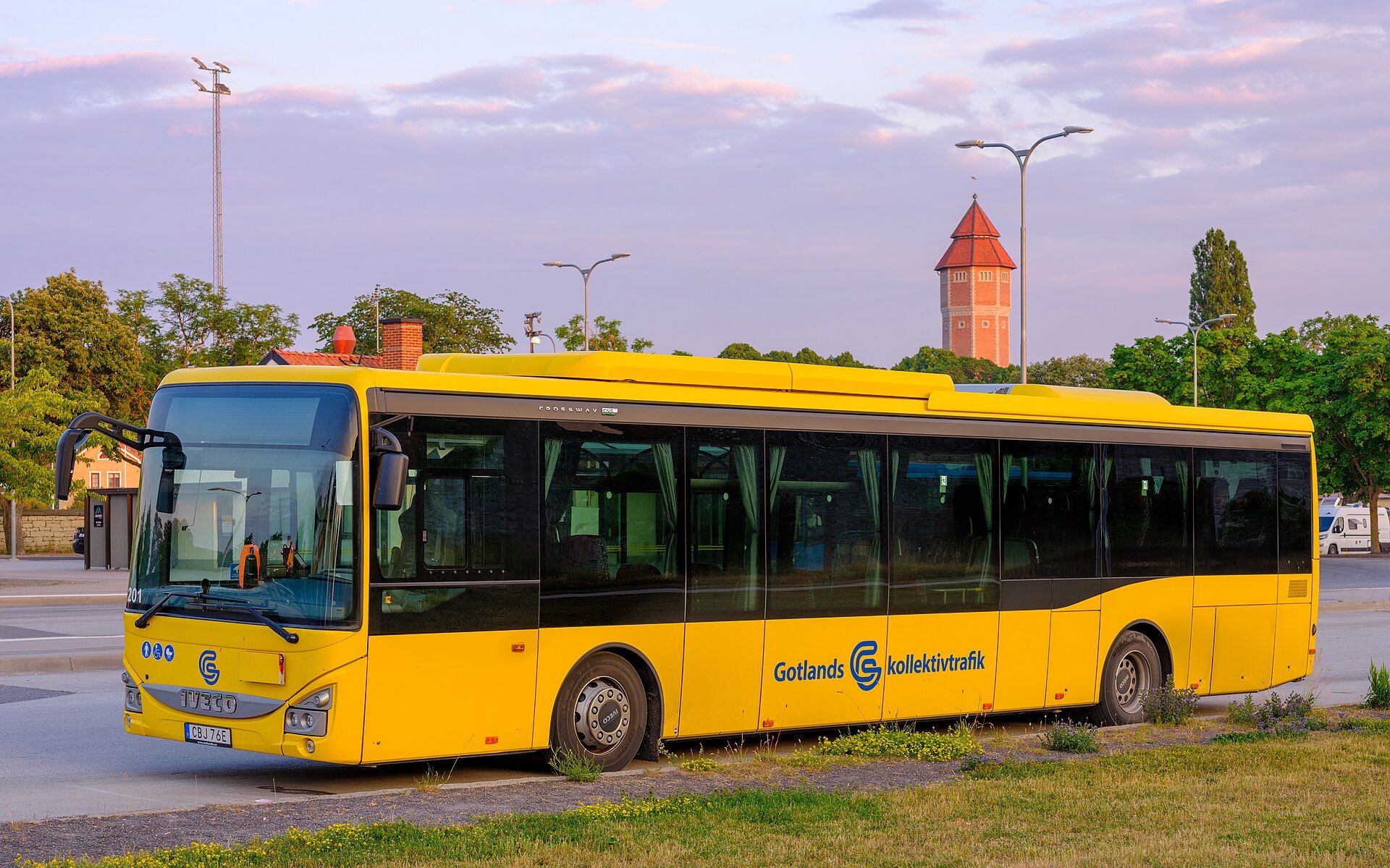 Yellow Iveco Crossway CNG intercity bus in Gotlands kollektivtrafik livery standing at Visby bus station, Gotland, Sweden