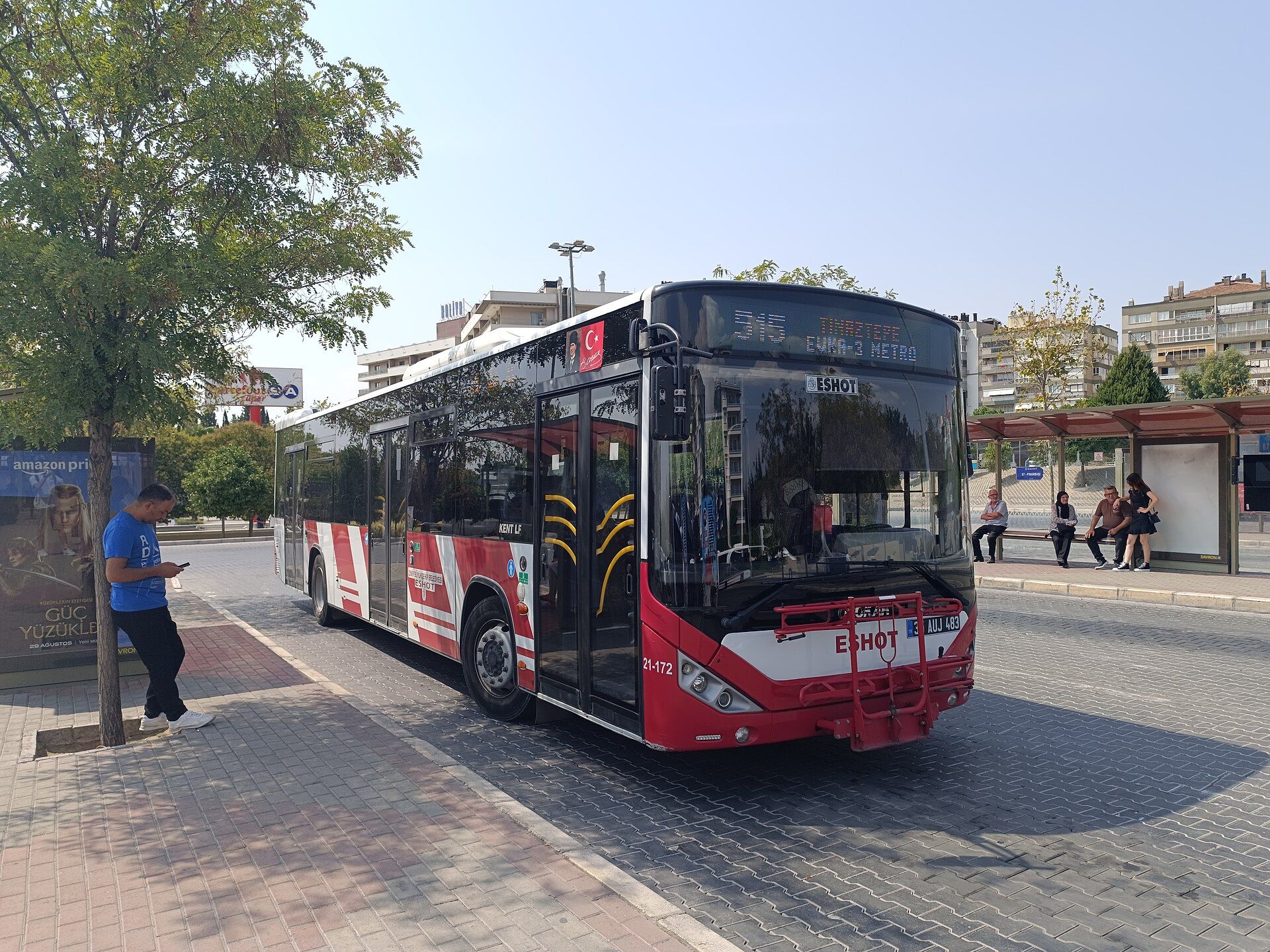 Otokar Kent LF city bus in ESHOT municipal livery at a stop in İzmir